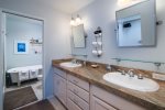 The master bath offers dual vanity sinks and a soaking tub